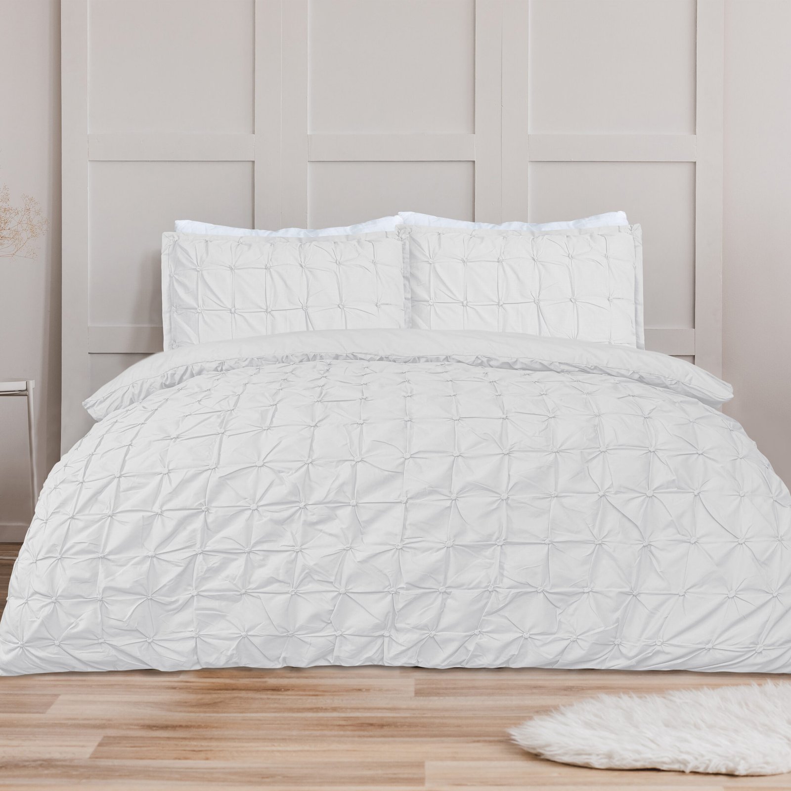 White pillow on blue bedding on king size bed in fashionable bed