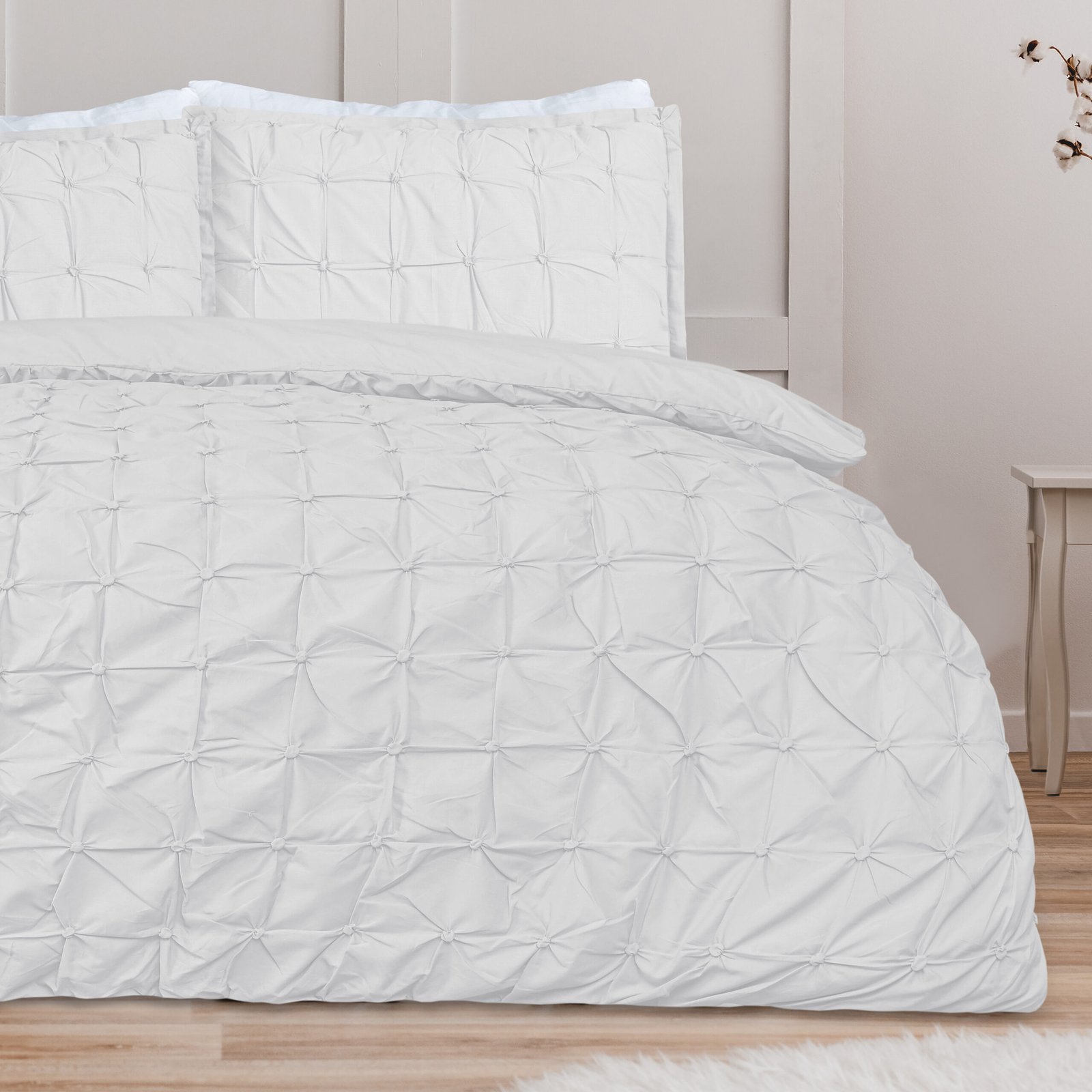 White pillow on blue bedding on king size bed in fashionable bed