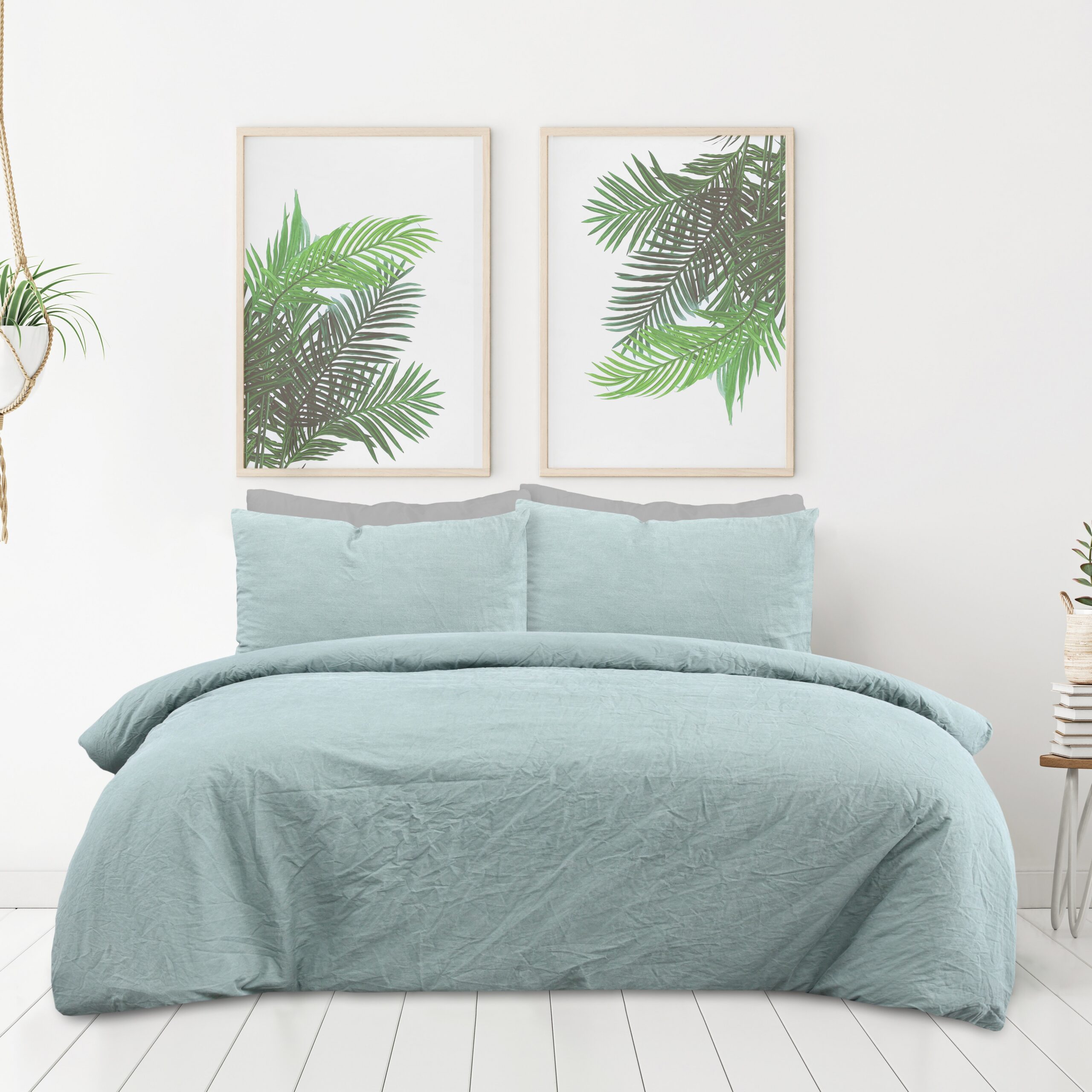 Poster mockup with two vertical frames on empty white wall in bedroom interior with bed, green plaid and plants. 3D rendering.